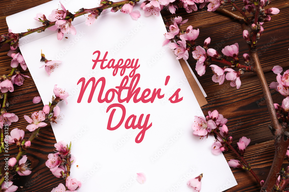 Happy mother's day lettering with a beautiful blossom flower Happy mother's day lettering with a beautiful blossom flower