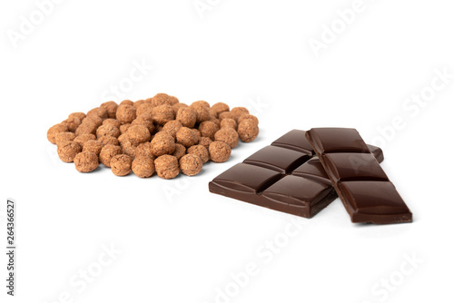 Chocolate dried balls and chocolate bar isolated on white background.