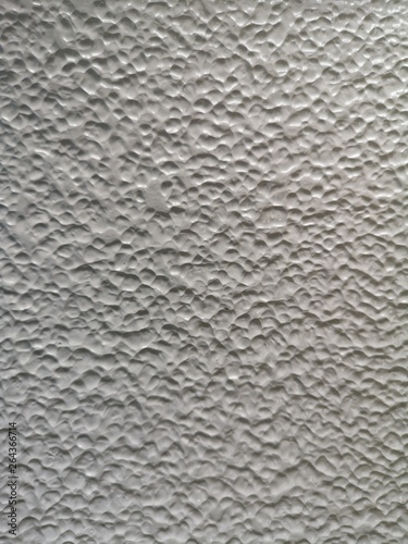 paint bomb white color on the wall rough surface texture material background