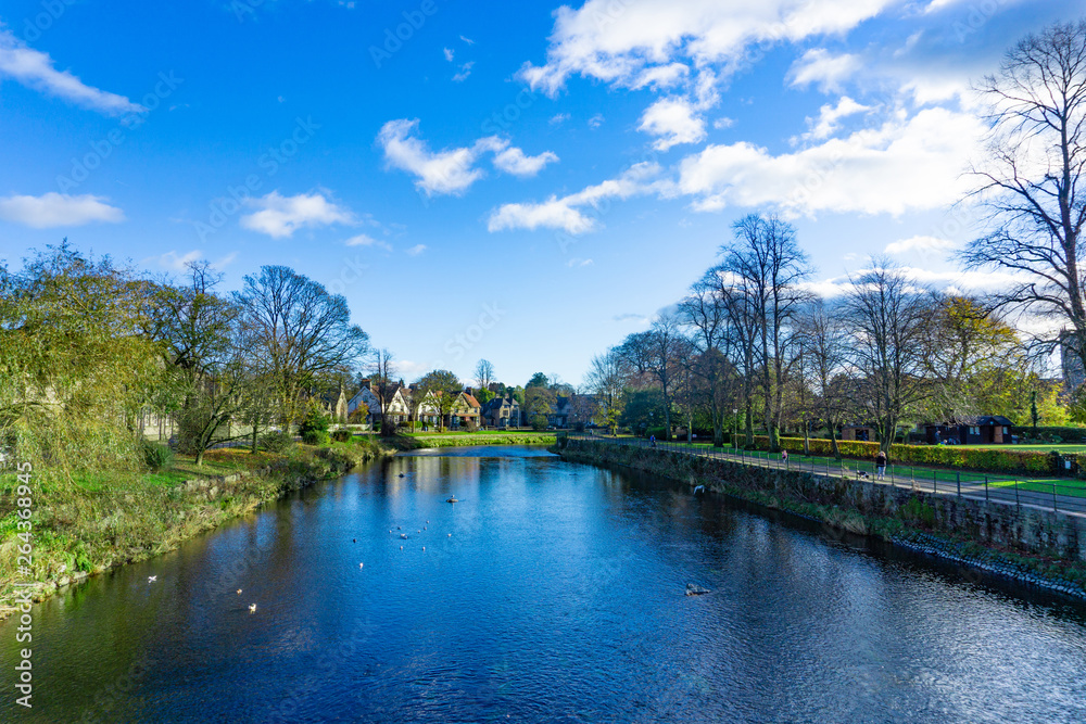 Cityscape of River Kent in Kendal, Cumbria, England in cloudy blue sky day