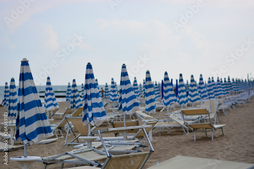 chairs and umbrellas on the beach,still closed in the morning at dawn