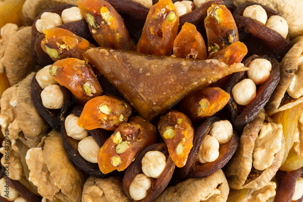 the special dried fruits and nuts plate concept for store seller. dried apricot,fig ,hazelnut, nut,special Turkish east food. the special dried fruits and nuts plate concept for store seller. dried apricot,fig ,hazelnut, nut,special Turkish east food.