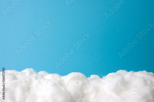 cloud made out of cotton wool on sky blue background photo