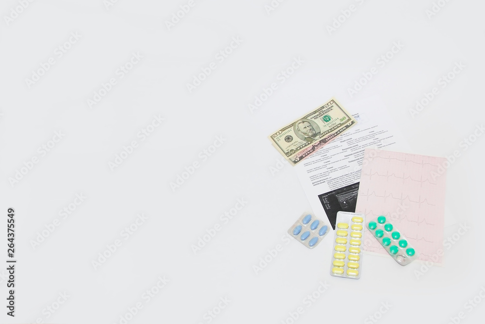 dollars, pills, cardiogram and medical a appointment on white background dollars, pills, cardiogram and medical a appointment on white background