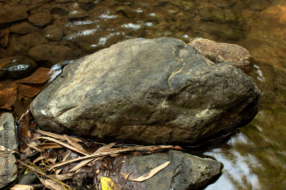 stone in waterfall