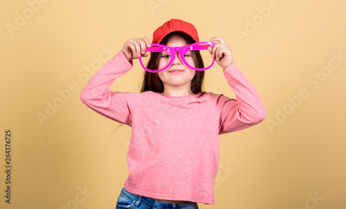 My goggles as unique as me. Cute smal child with fashion goggles accessory. Adorable little girl wearing fancy goggles. Finding the perfect goggles frame for her © be free