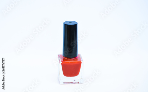 Manicure salon. Beauty and care concept. Nail polish white background. Durability and quality of nail polish coating. Gel polish modern technology. Pick color. Nail polish bottle bright color