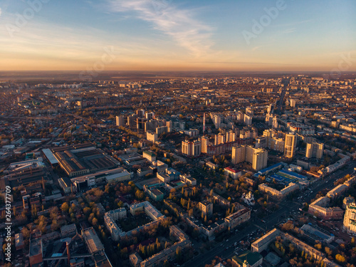 Aerial Voronezh city midtown panorama at sunset, roads with car traffic and buildings, center of old European city in spring