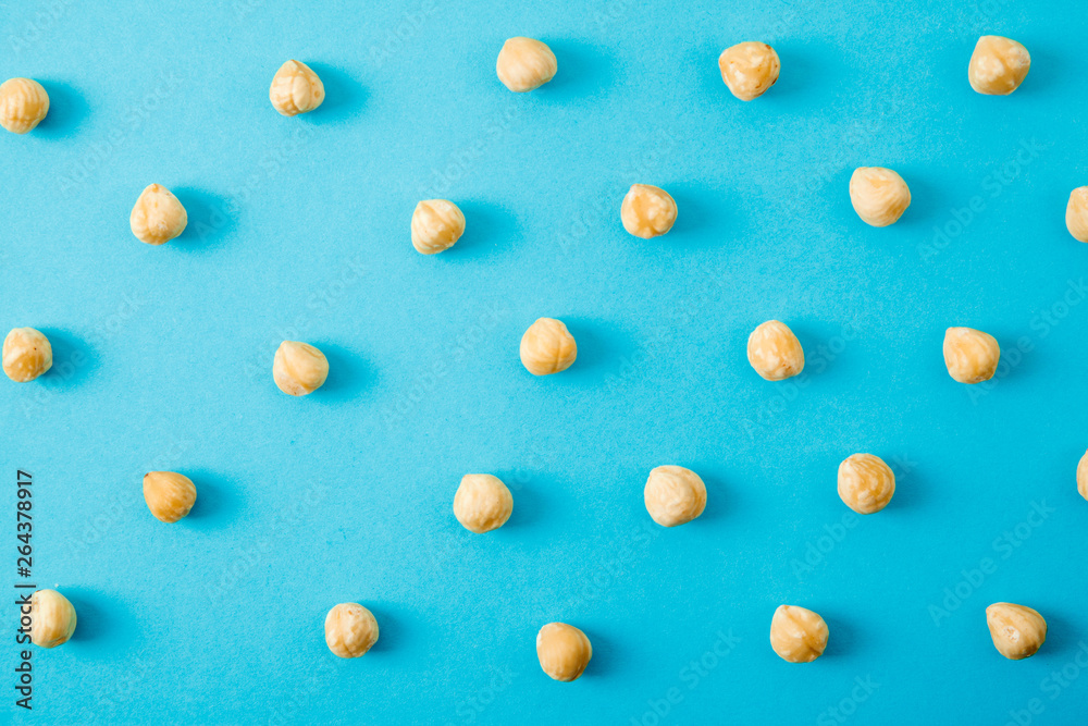 Nuts pattern - hazelnut on white background.
