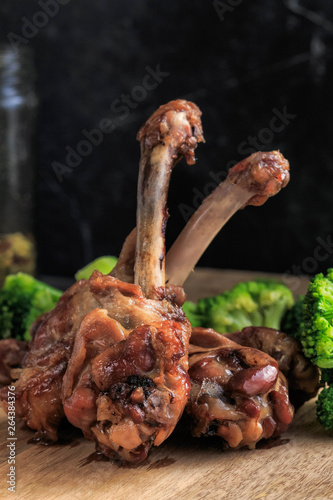 Roast Duck drumstick served with sweet chili sause and vegetables.