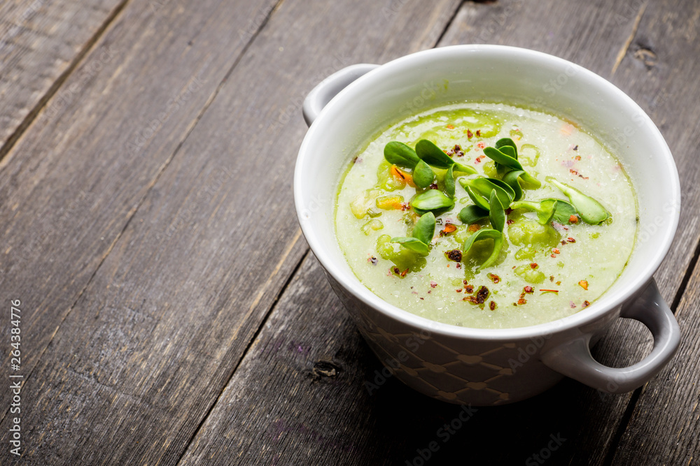 Hot green peas soup on the rustic background. Selective focus. Shallow depth of field. Hot green peas soup on the rustic background. Selective focus. Shallow depth of field.