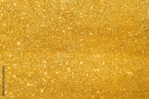 sparkles of golden glitter abstract background © เอกชัย โททับไทย