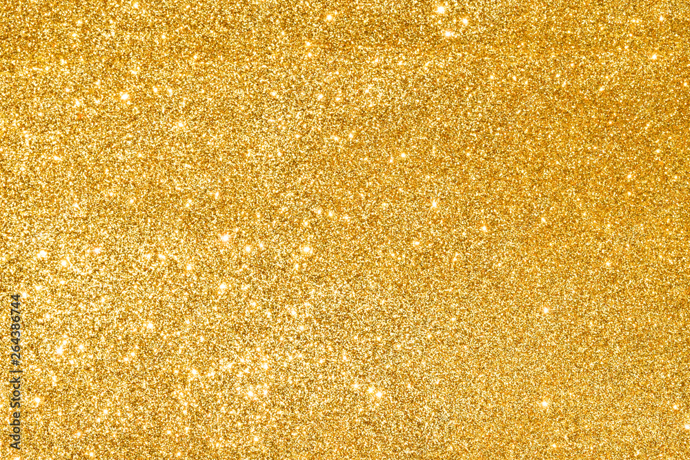 sparkles of golden glitter abstract background