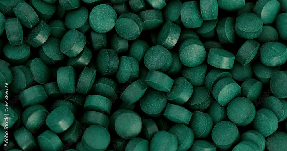 Close up chlorophyll spirulina tablet rotation , healthy detox suplement , 4k dci resolution Close up chlorophyll spirulina tablet rotation , healthy detox suplement , 4k dci resolution