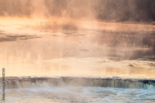 View of the Rumba Falls in the city of Kuldiga, Latvia. Early spring morning. 