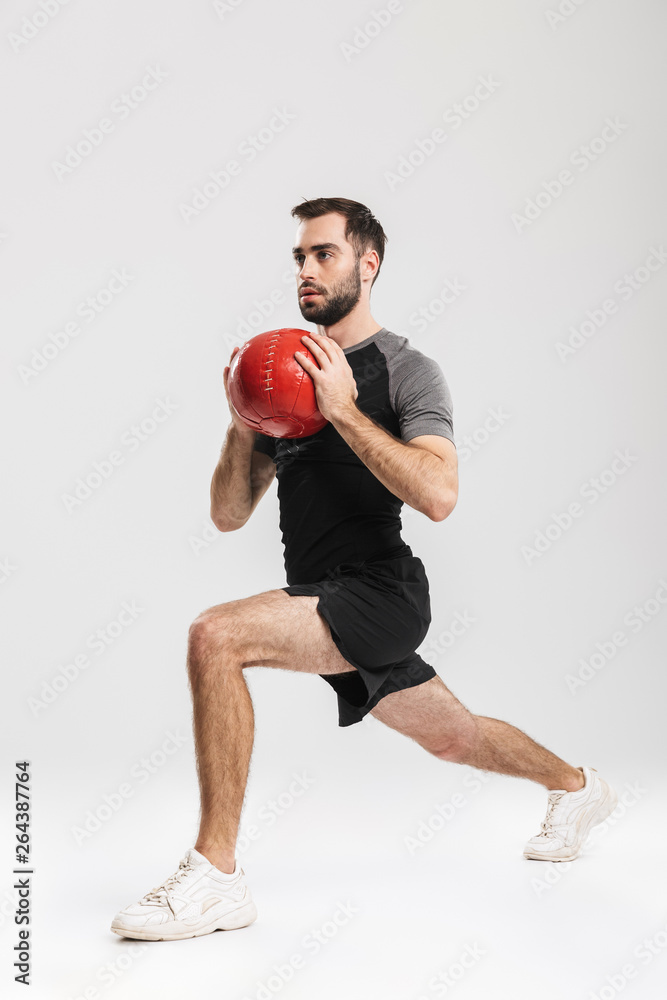 Confident motivated sportsman doing exercises