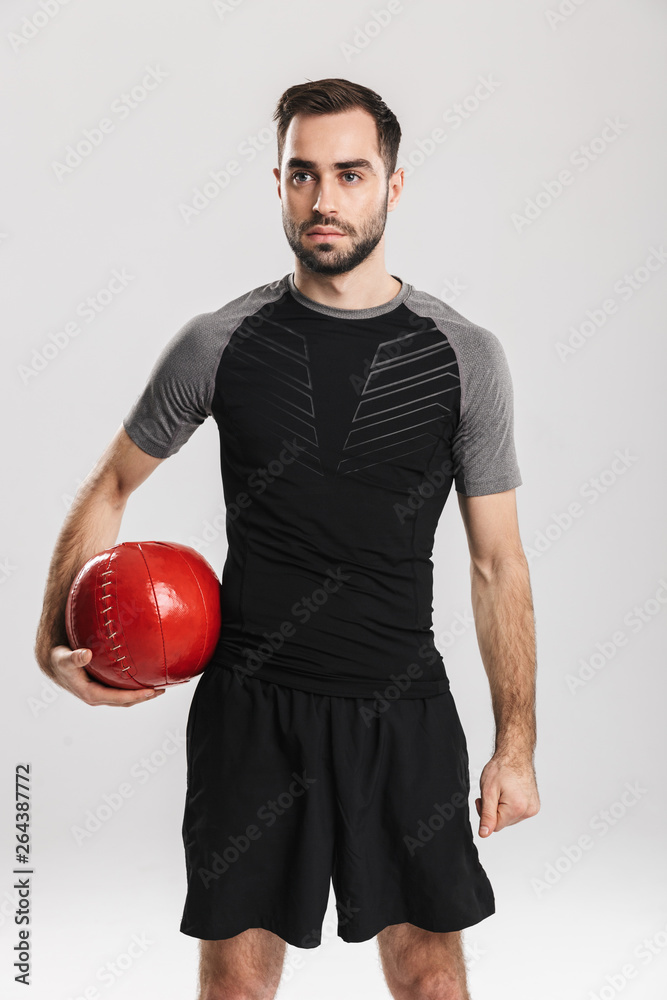 Confident motivated sportsman doing exercises Confident motivated sportsman doing exercises