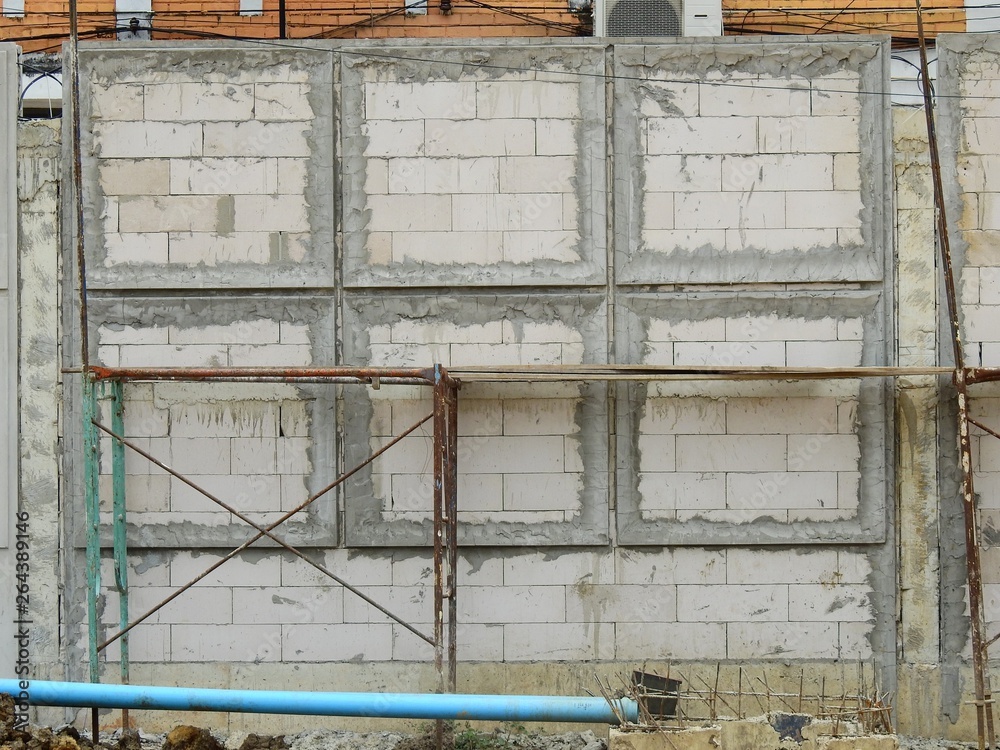 aged street block wall in construction site aged street block wall in construction site