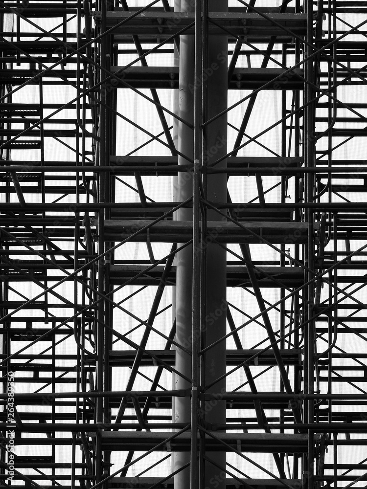 Silhouette scaffolding in construction site