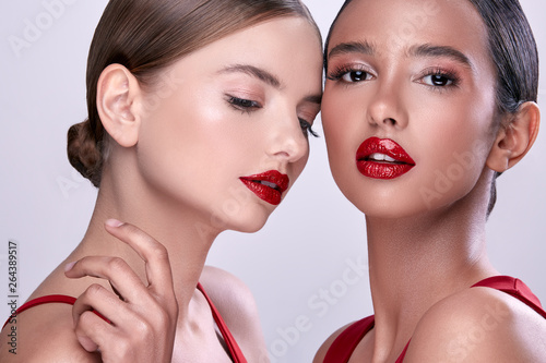 two beautiful women with red lipstick  sexy women with make-up  pretty girls in red