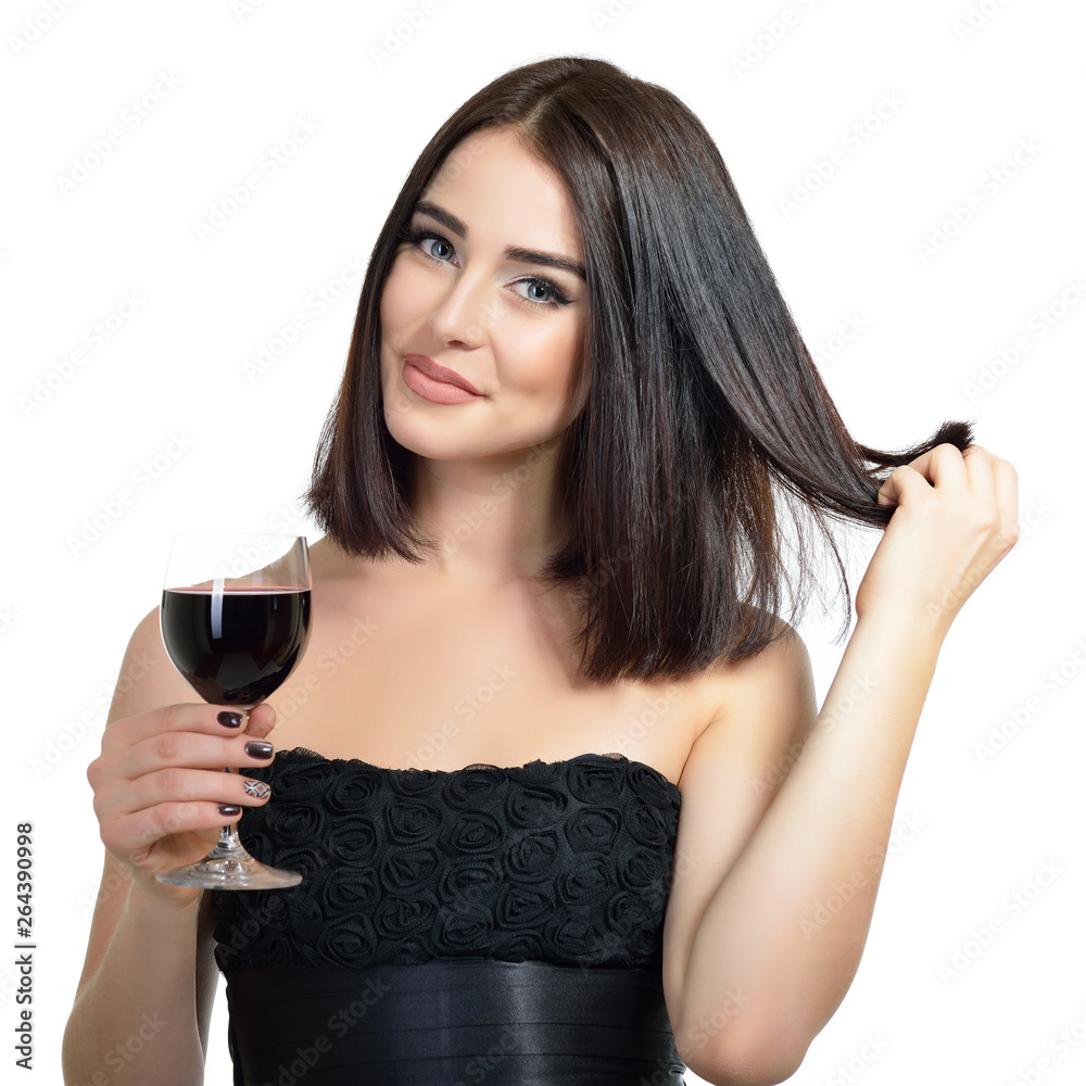 Young attractive woman holding glass of red wine. Pretty lady drinks alcoholic drink. Beautiful girl wearing black dress  with glass of wine isolated on white background.