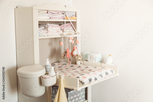 Baby changing table in light bedroom © vickyrandom