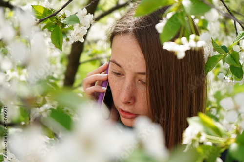portrait of young woman in spring garden