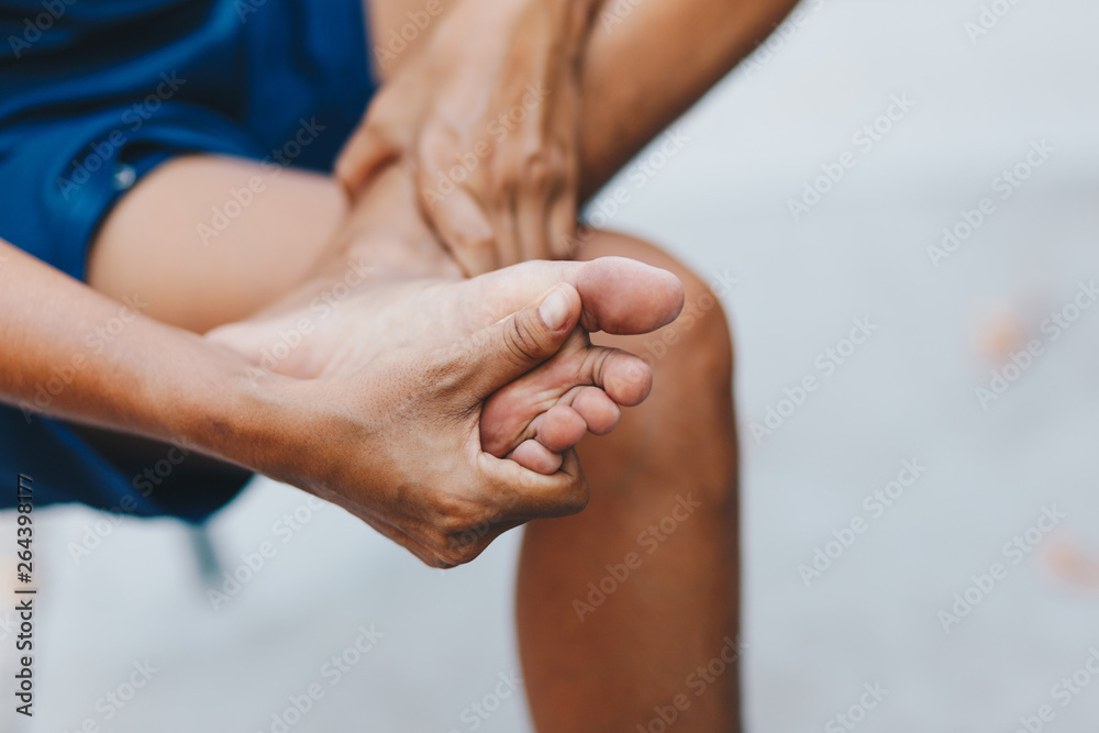 Fototapeta premium young woman pain in her foot