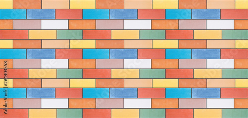 A seamless texture from multi-colored ceramic bricks made in a wall