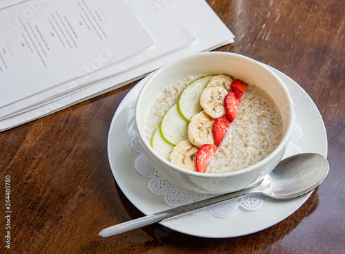 oatmeal for breakfast on a wooden surface