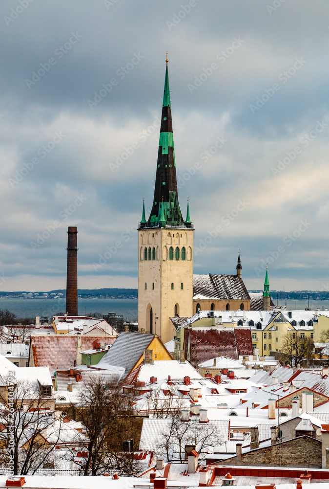 Aerial view of Tallinn city and St Olaf Church. Medieval old town in winter time. Capital of Estonia