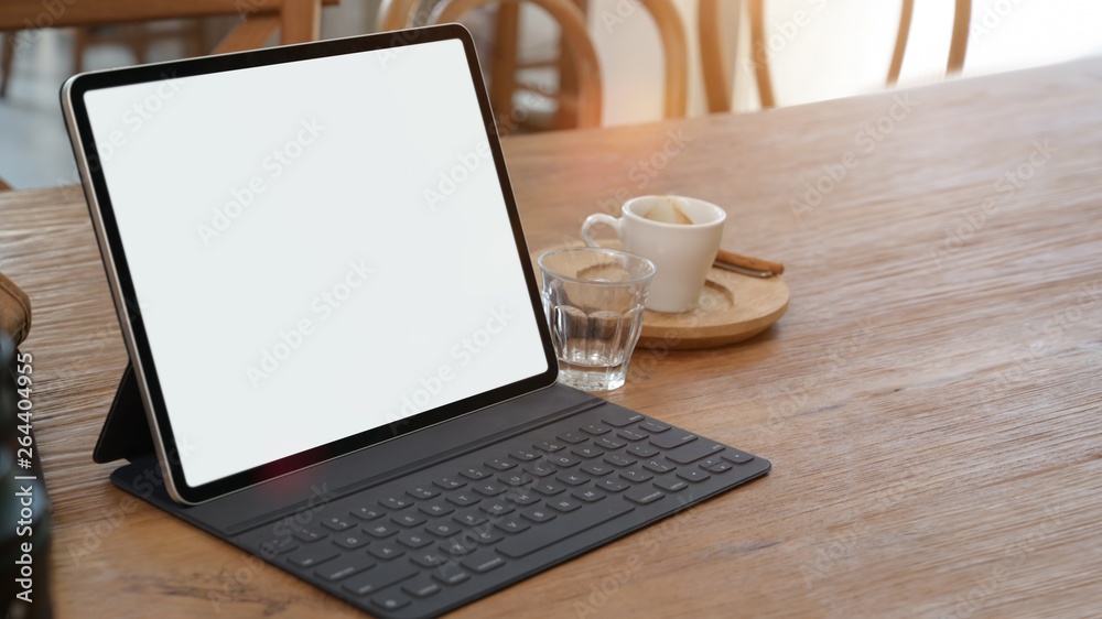Mockup blank screen tablet on desk with copy space Mockup blank screen tablet on desk with copy space