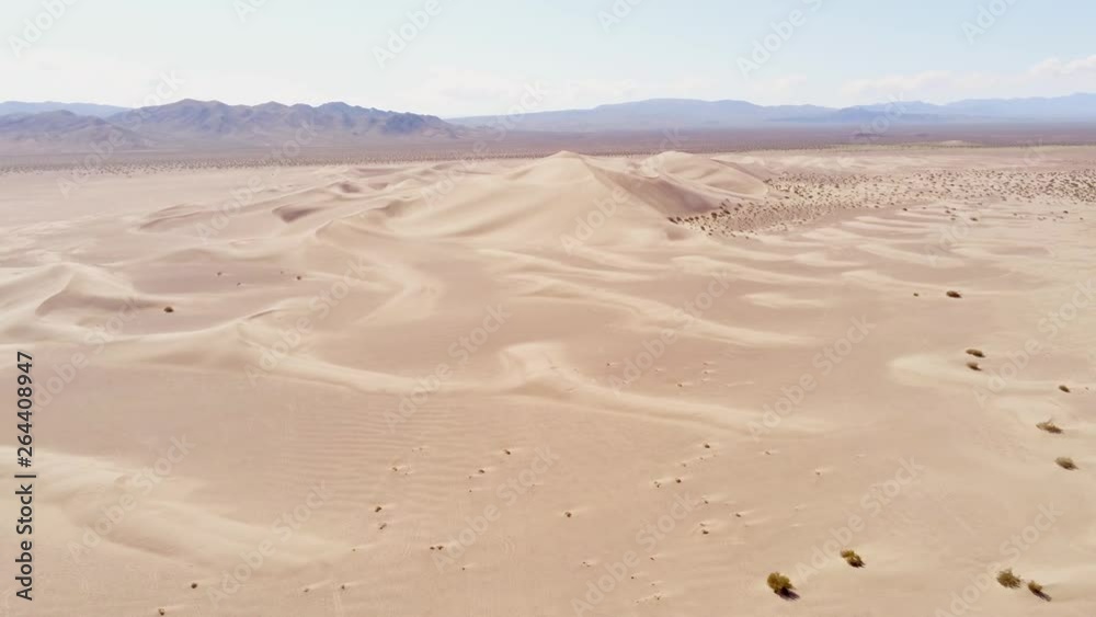 Flight over a desert with beautiful sand dunes - aerial photography Flight over a desert with beautiful sand dunes - aerial photography