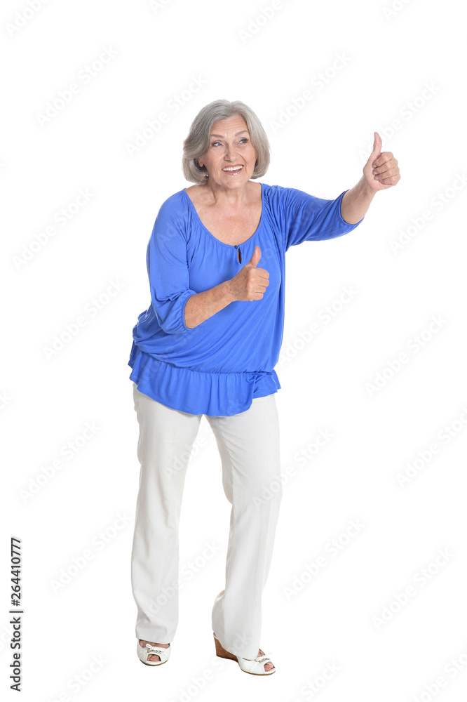 Full length, happy senior woman with thumbs up, isolated Full length, happy senior woman with thumbs up, isolated