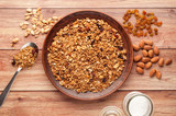 Bowl with granola on a wooden background