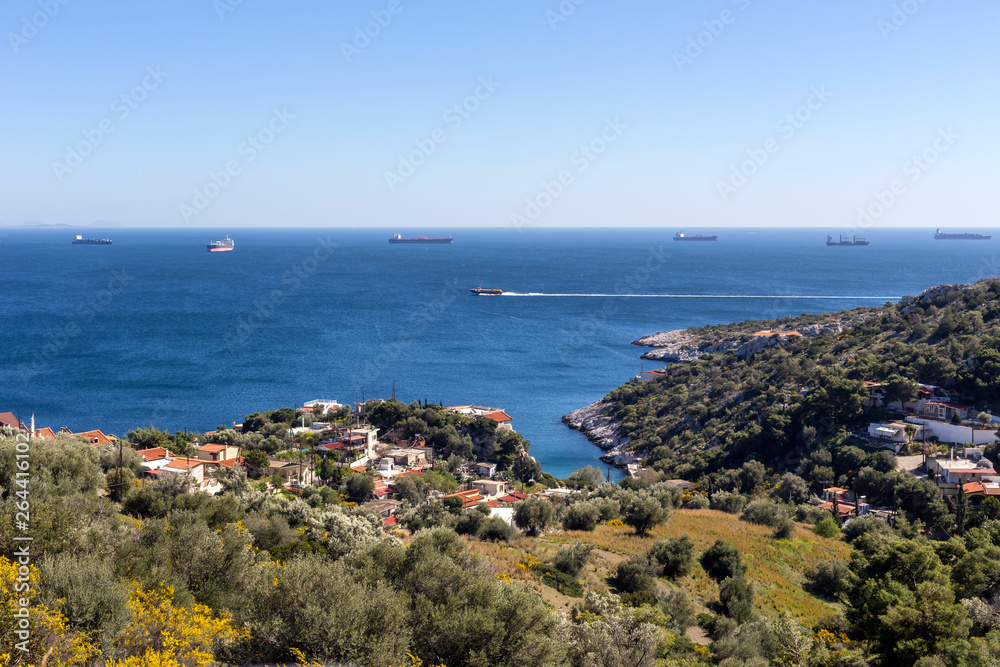 View of the mountains, village and the sea from the cliff (Greece, Salamis Island)