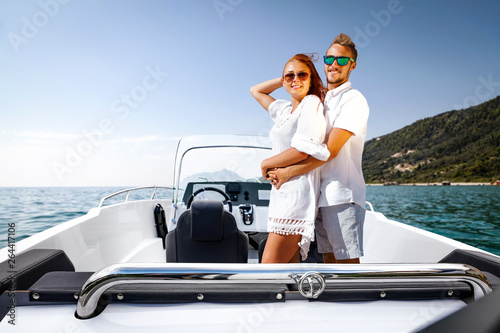 Two young people on summer boat and ocean landscape 