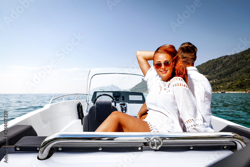 Two young people on summer boat and ocean landscape  © magdal3na