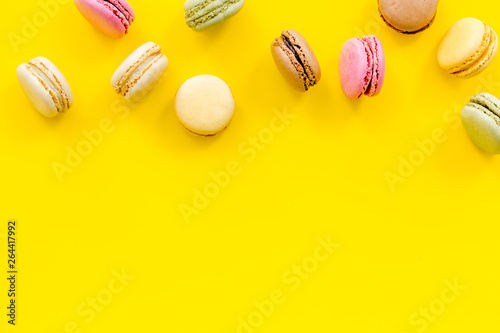 sweet dessert pattern with macarons on yellow background flat lay mockup