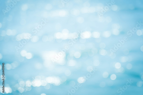 Blur beautiful nature summer on tropical beach with bokeh sun light wave abstract background.