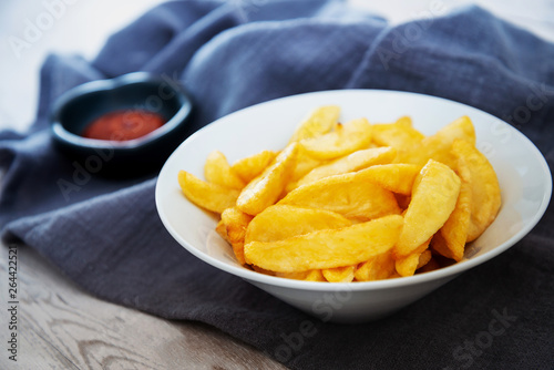 Fototapeta Naklejka Na Ścianę i Meble -  Golden French fries potatoes ready to be eaten