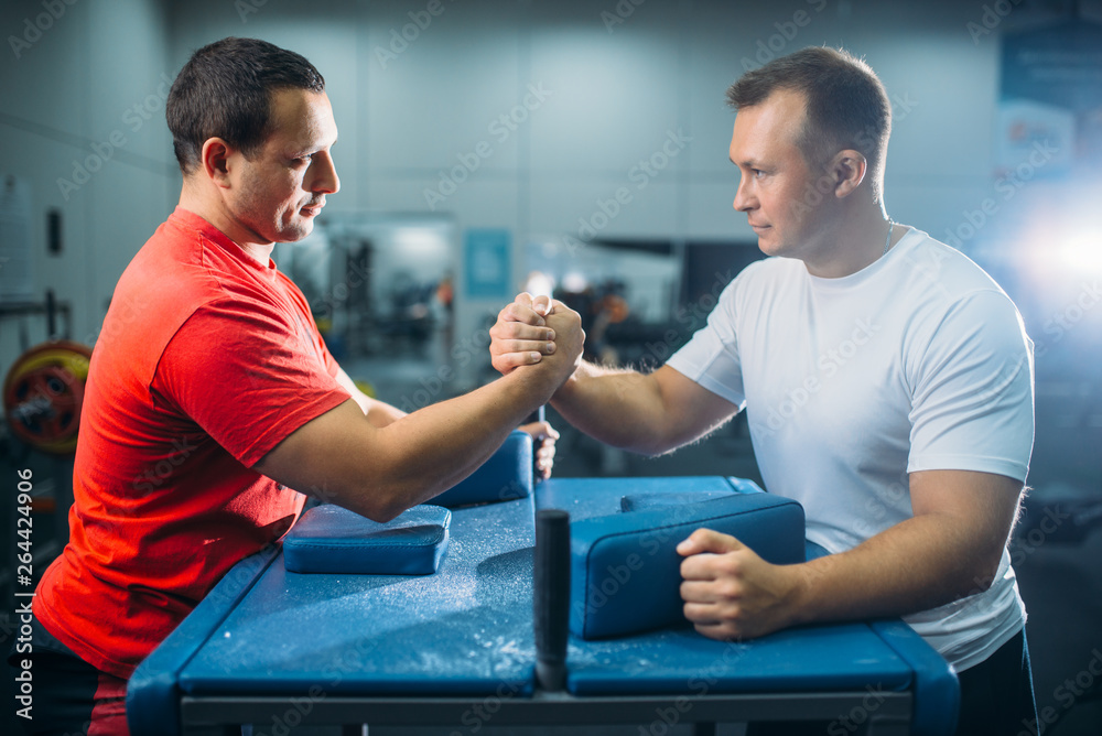 Arm wrestlers prepares for battle at the table Stock Photo Adobe Stock