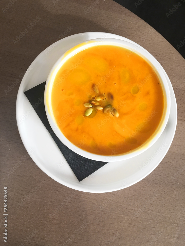 Pumpkin soup on a wooden table Pumpkin soup on a wooden table