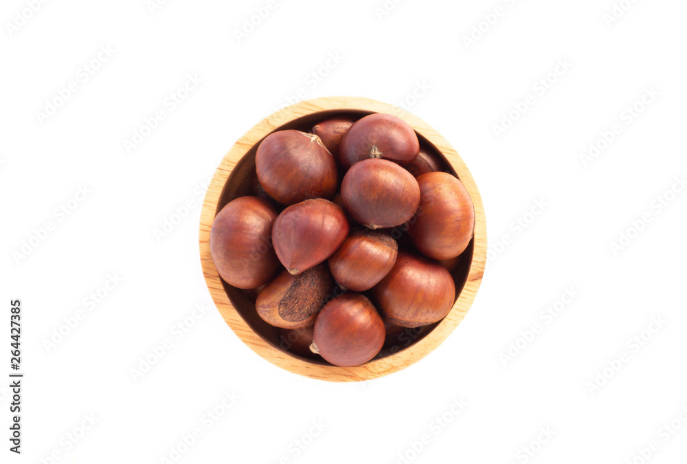 Closeup horse chestnuts in wood bowl isolated on white background,  healthy food concept