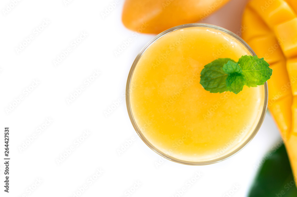 Closeup glass of mango fruit juice isolated on white background Closeup glass of mango fruit juice isolated on white background