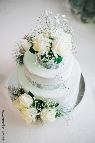 wedding cake with flowers yellow beige red turquoise blue