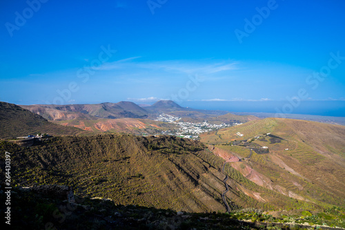 Spain, Lanzarote, Mountain road to palm tree village haria in evening sunlight
