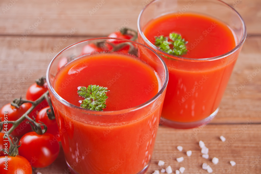 Tomato juice with parsley and salt on the jute napkin Tomato juice with parsley and salt on the jute napkin