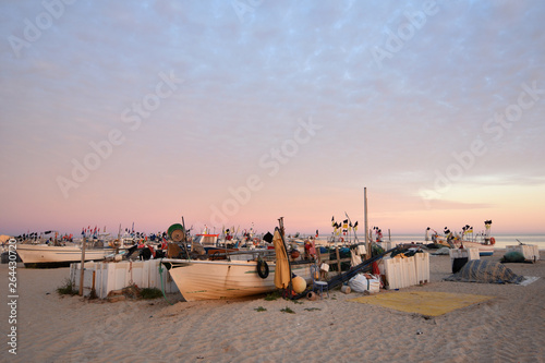 fishing boats on the beach of Monte Gordo, Algarve, Portugal © curto