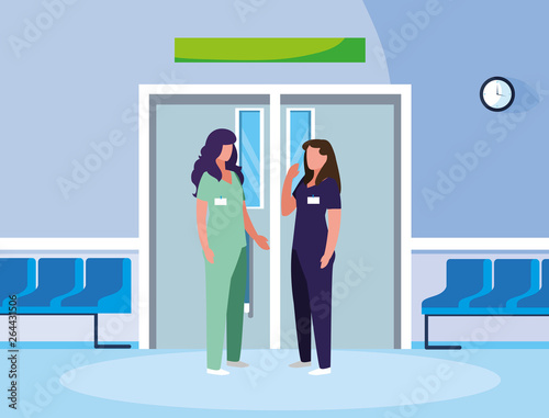female medicine workers in elevator door